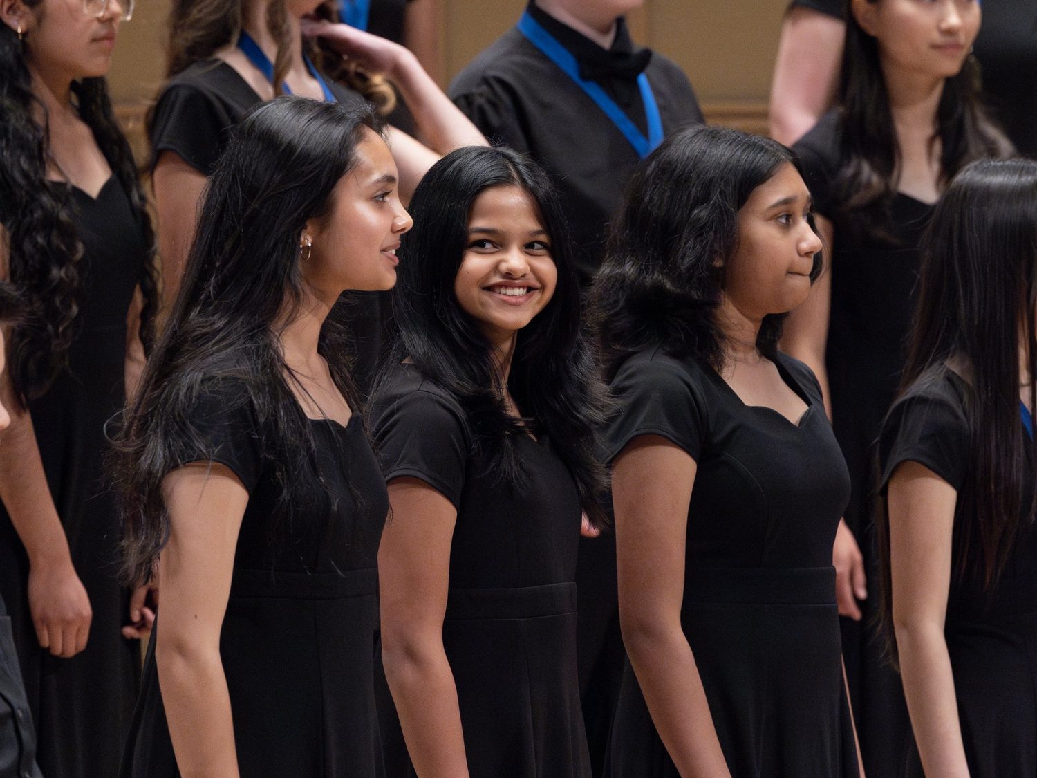 DCC choristers sharing a smile together after a performance
